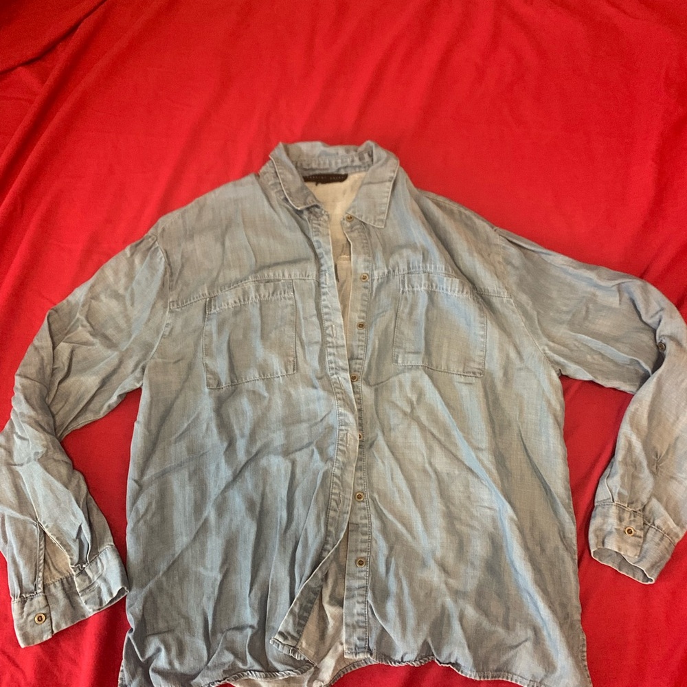 Woman’s large thin blue Jean shirt